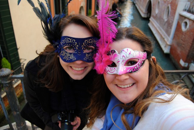 Mel and I with our masks on one of Venice's many bridges.