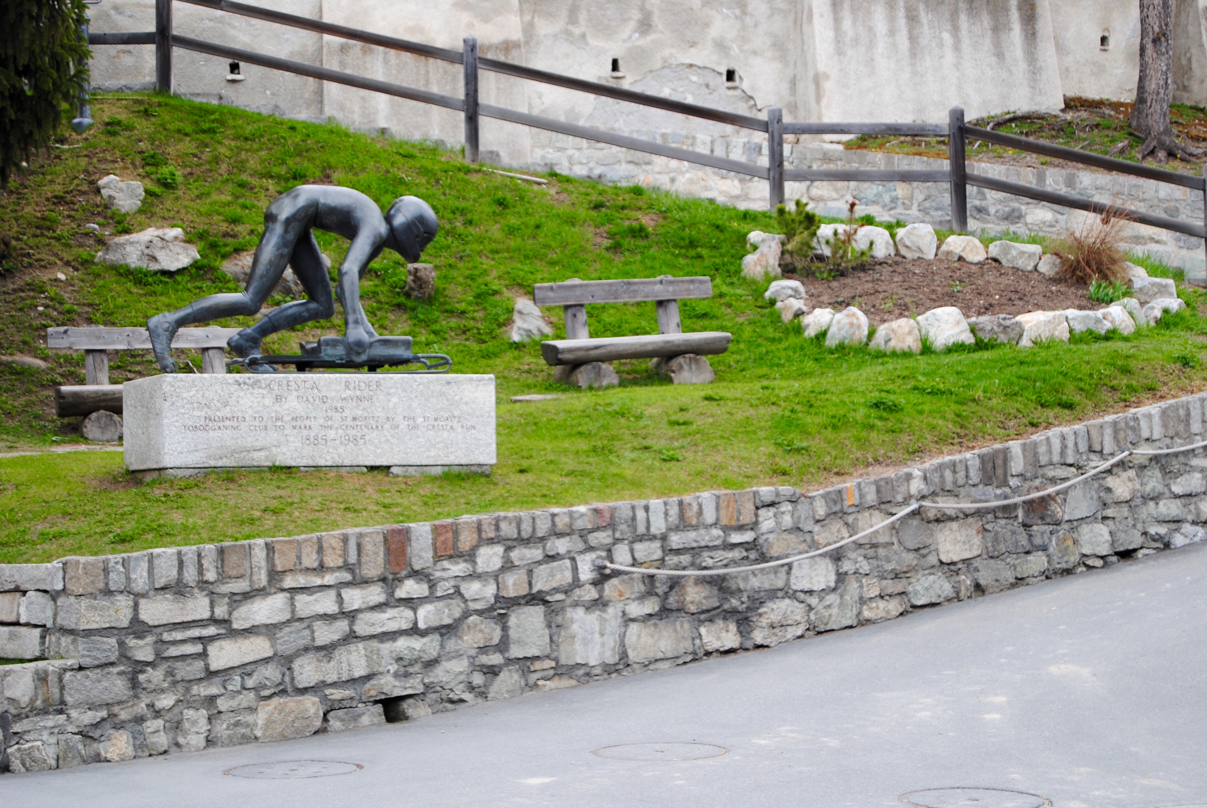 The sign and sculpture along the site of the Cresta run.